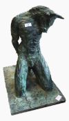Bronze effect sculpture of a kneeling Minotaur, his hands behind him, on rectangular base, unsigned,