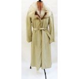 Sheepskin jacket and a light grey full-length leather coat with a fox fur collar,