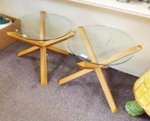 Pair of modern lightwood glass-topped occasional tables,