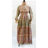 Victorian woollen gown, paisley pattern with lace trimming on collar and cuffs,