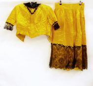 Child's dressing up outfit with yellow satin skirt trimmed with jet beads and black lace and a
