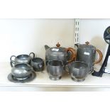 Tudric pewter teaset comprising teapot, hot water jug, two-handled sugar bowl and milk jug,