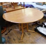 Ercol elm oval drop-leaf dining table with central quadruple panelled square section supports