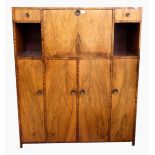 Early 19th century figured walnut cocktail/entertainment cabinet having central cocktail cabinet