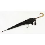Vintage umbrella with a carved faux horn handle,