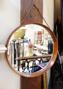 20th century teak and leather wall mirror, circular, plain with leather hanging cord,