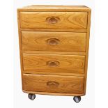 Ercol elm chest of four drawers, all with oval dished handles, on castors, 46.