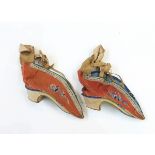 Pair of Oriental silk embroidered shoes for bound feet and a pair of Eastern-style leather shoes