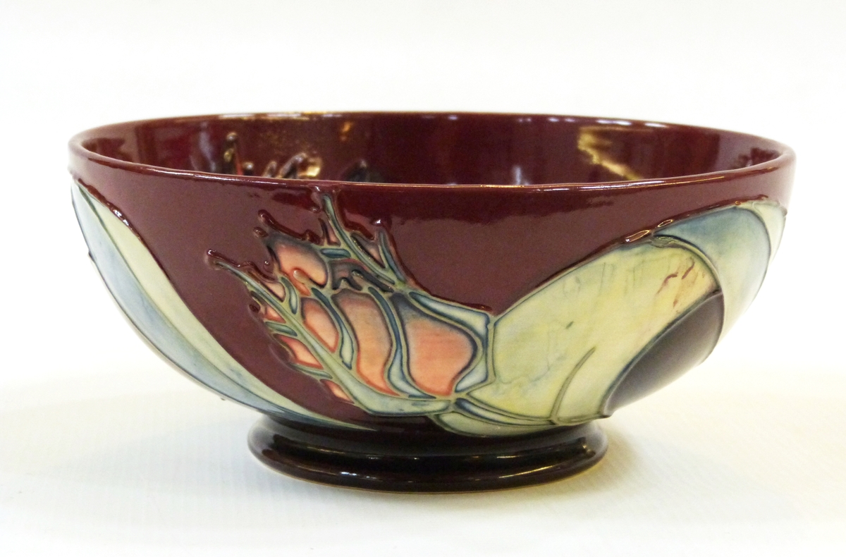 Modern Moorcroft pottery bowl, stylised tulip decorated, on a burgundy coloured ground, - Image 2 of 2