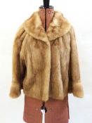 Short swing mink jacket with bracelet bell sleeves and a mink stole (2)