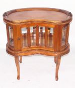 Walnut kidney-shaped drinks cabinet with loose tray top,