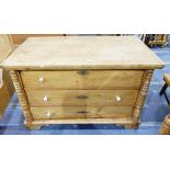 Old pine chest of three drawers flanked by turned split pilasters and on bracket feet,