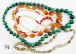 Long agate bead necklace, a polished cornelian necklace and bracelet set, a malachite bead necklace,