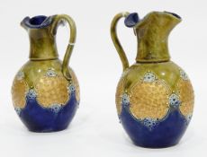 Pair of Royal Doulton stoneware baluster-shaped jugs with trefoil rims,