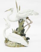 Lladro porcelain model of a pair of cranes amongst reeds,