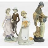 Three various Nao by Lladro porcelain figure groups to include girl holding pumpkin,
