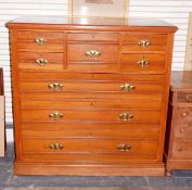 Edwardian satin walnut chest of drawers having five small drawers over three graduated long drawers,