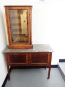 Edwardian inlaid mahogany washstand having variegated grey and white marble top,