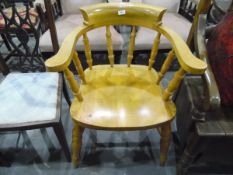 Beech framed smokers/captains chair with turned spindle back and on turned supports