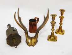 John Linwood brass meat jack, a pair of brass candlesticks,