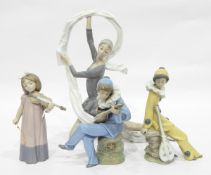 Quantity of Nao by Lladro porcelain figure groups to include young girl playing violin,