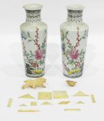 Pair of Oriental porcelain vases, with tall flared necks and circular tapering form,