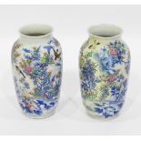 Pair of late 19th/early 20th century Japanese vases of baluster form decorated in blue and white