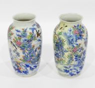 Pair of late 19th/early 20th century Japanese vases of baluster form decorated in blue and white