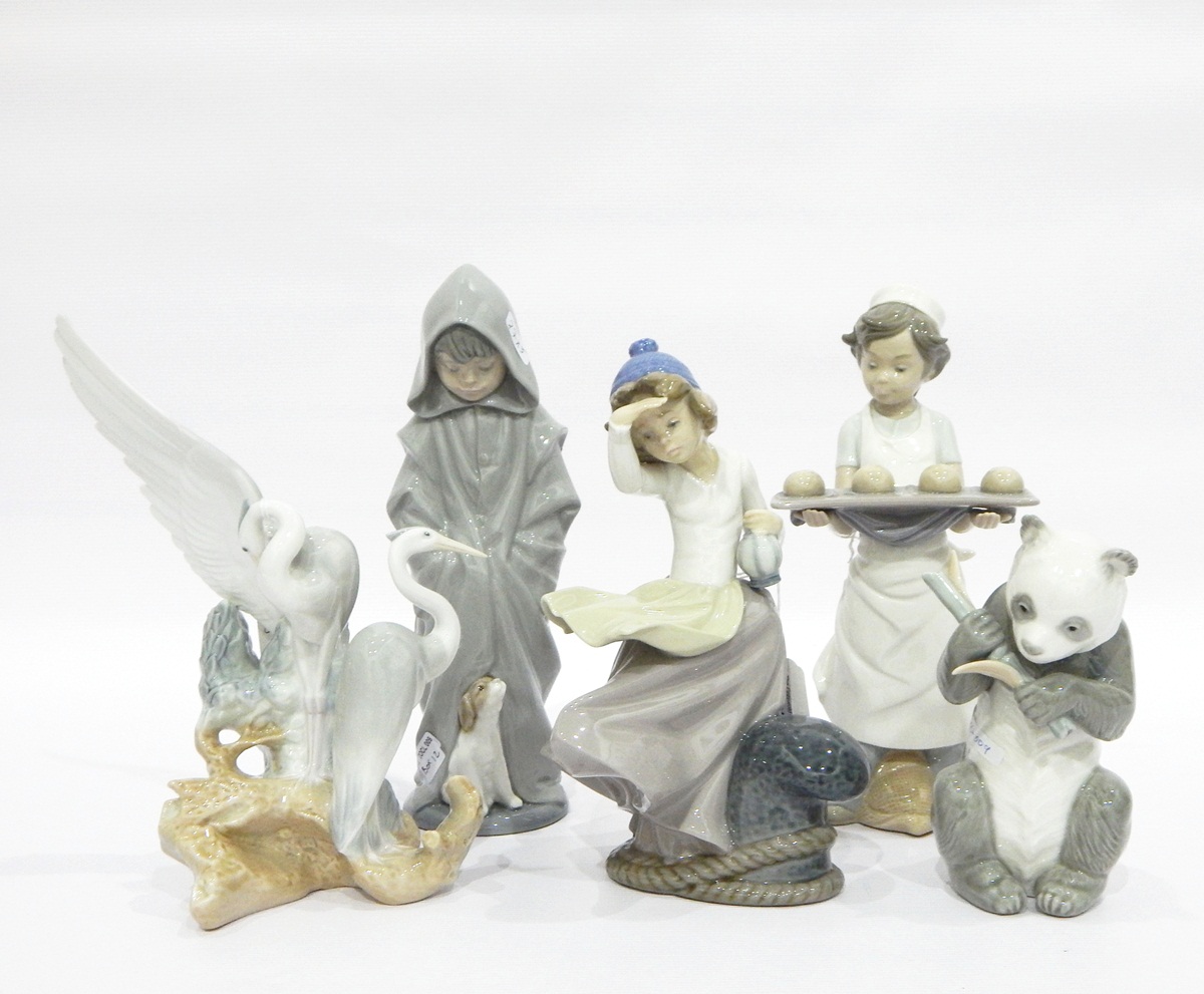 Collection of Nao by Lladro porcelain models to include panda, girl looking out to sea, baker boy,