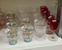 Six water glasses painted with flowers and polka dots,