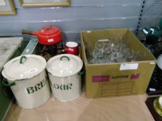 Two vintage enamel storage bins marked 'bread' and 'flour',