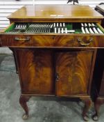 Pair of mahogany cabinets and contents of plated cutlery,