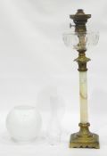 Brass and onyx table oil lamp, the square brass base with foliate scroll decoration,