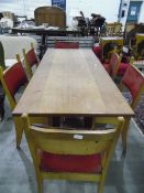 Oak refectory-type table on twin standards and straight stretcher,