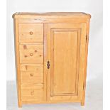 Pine cupboard incorporating four drawers with turned knob handles,