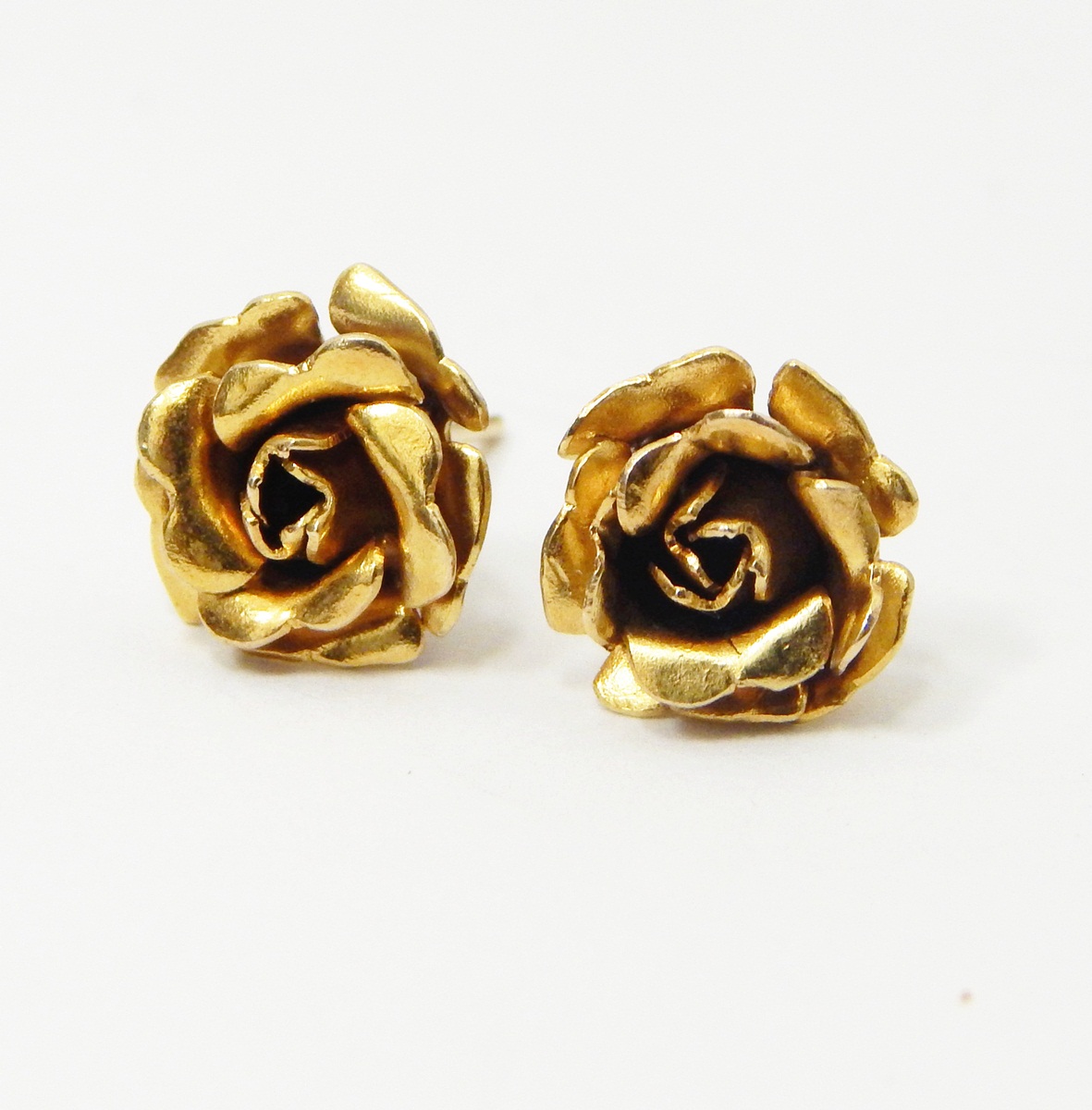 Pair of 9ct gold stud earrings, modelled as roses, approx. 2.