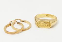 Egyptian gold-coloured ring of signet ring design decorated with hieroglyphics with Egyptian gold