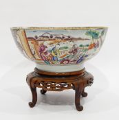 Chinese porcelain famille rose punch bowl painted in panels with figures in lakeside garden,