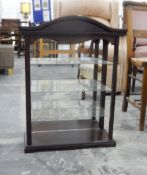 Stained as mahogany hanging wall display case having three glass open shelves,