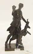 Bronze figure of the huntress Diana, with deer behind her, pulling an arrow from her quiver,