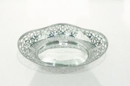 Silver-coloured metal basket, boat-shaped with wavy beaded border and scroll cut card pierced sides,