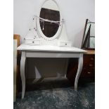 White painted dressing table having an oval pivoted mirror over two lace/trinket drawers,