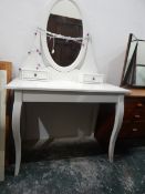 White painted dressing table having an oval pivoted mirror over two lace/trinket drawers,