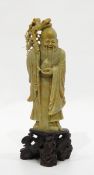 Chinese carved soapstone figure of Shou Lao holding staff and peach and the carved soapstone base,