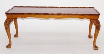 Burr walnut veneered coffee table with shaped piecrust rim,