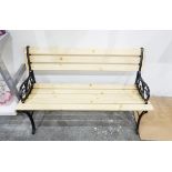 Garden bench seat with painted iron supports