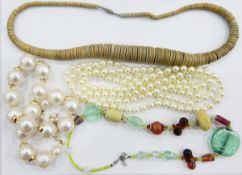 Large quantity of costume jewellery including simulated pearl necklaces, glass bead necklaces, etc.