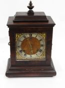 Regency-style mahogany bracket clock with urn finial,