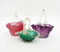 Stevens & Williams-style glass baskets with twisted canes pulled through clear glass,