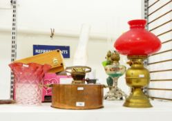 Oil lamp by P J Bryant of Bristol, with large circular copper base,